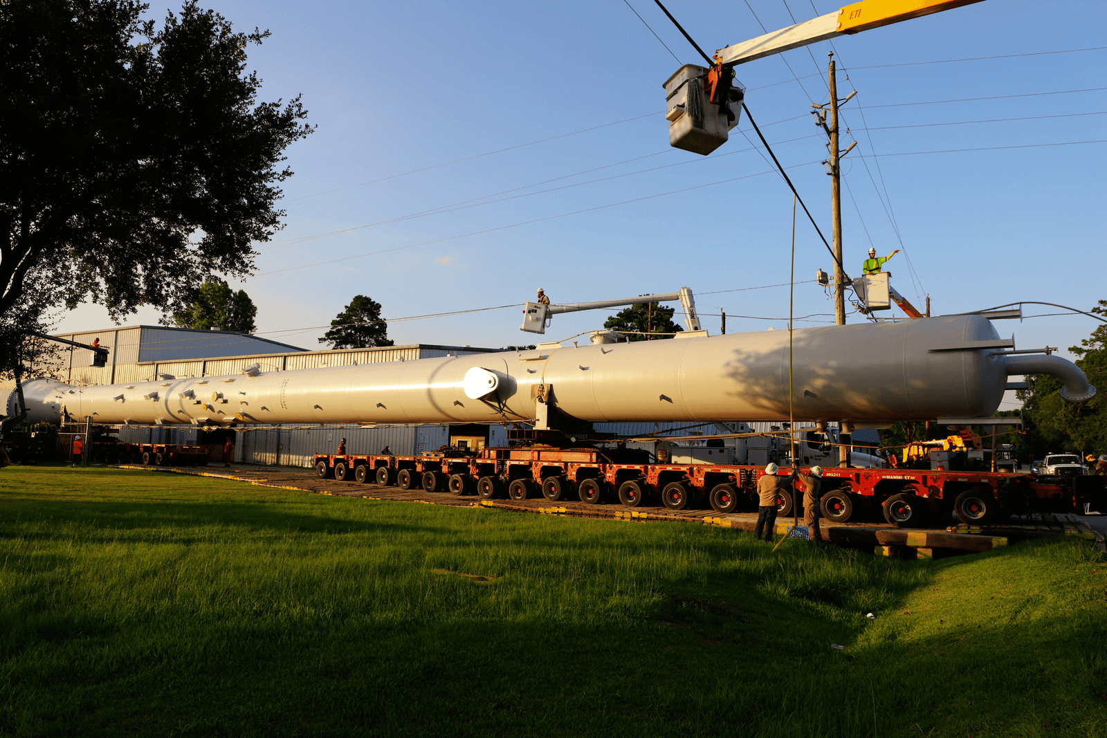 A finished GCAW process column staged for shipment on a multi-axle transporter