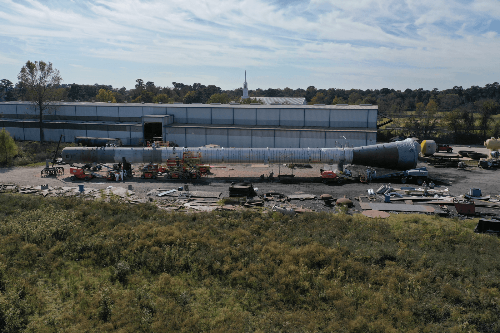 A long reactor vessel staged at the GCAW yard