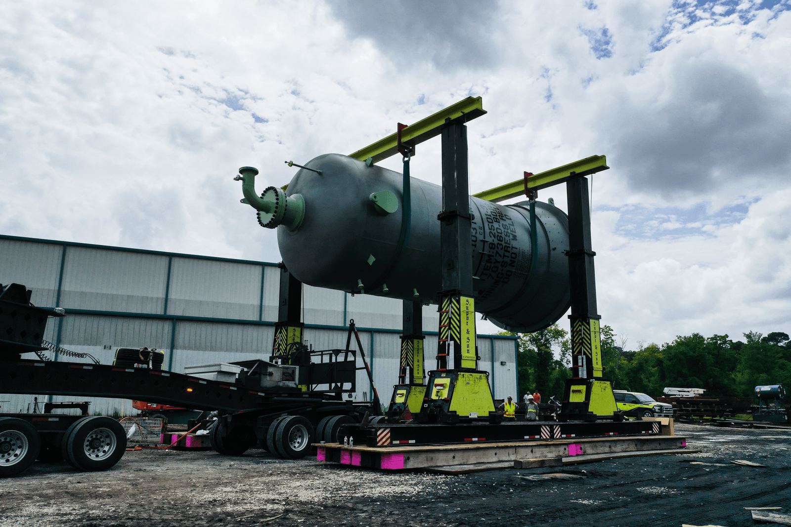 A horizontal storage drum on fabrication stands
